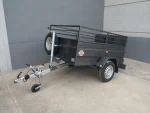 Remolque portamaquinaria industrial basculante 750 kg – con rampa de carga y ruedas exteriores